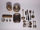 a lot of silver items that are on the table