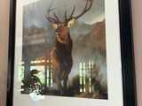 painting of a stag in a frame hanging on a wall