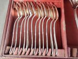 a lot of spoons that are in a box