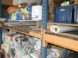 a shelf full of tools and other items in a garage