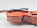 the back of a violin with a bow resting on top of it