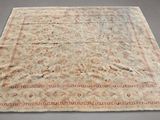 an old rug with a red border on a grey background