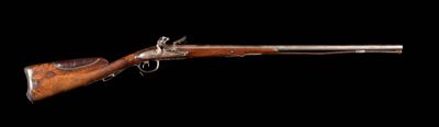 un vieux fusil au canon en bois sur fond noir
