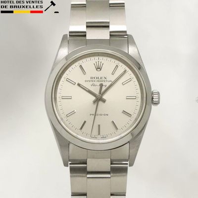 an image of a rolex watch with a white dial and roman numerals