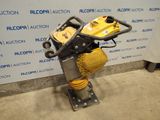 an image of a small machine that is sitting on a stand