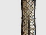 a vase that is made out of wood and has metal decorations on it