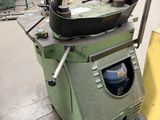 a machine that is sitting on the ground in a warehouse