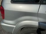 a dog that is sitting in the back of a car
