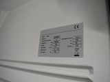 a close up of a white refrigerator with a label on it