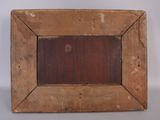 an old wooden picture frame with a brown stain on it