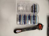a couple of razors and a razor blade sitting on a table