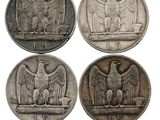 quatre types différents de pièces d'argent sur fond blanc