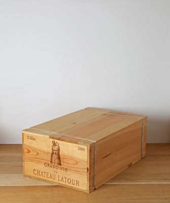 a wooden box with a wooden handle on a wooden table
