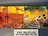 a picture of the beatles ' s golden hits album on the wall