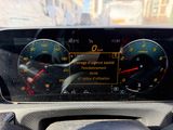 a car dashboard with a speedometer and gauges on it