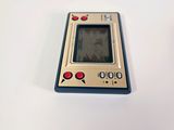 a small electronic device sitting on a white surface