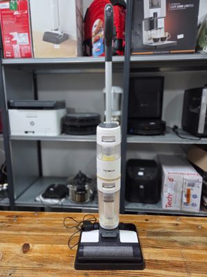 an image of a vacuum cleaner on a wooden table