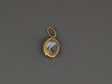 a gold plated pendant with a faceted quartz stone