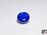 a blue oval stone with a white background