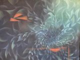a painting of a flower on the wall of a building