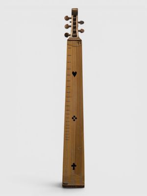 une image représentant un instrument en bois à long manche sur fond blanc