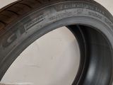 a close up of a tire on a white surface