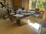 an image of a desk with a lot of books on it