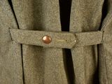 a close up of a coat with a button on it