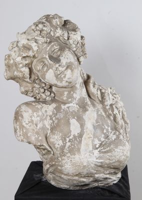 statue of a woman with a flowered head on a black base