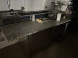 an image of a kitchen with stainless steel appliances and granite counter tops
