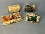 three small boxes with different designs on them sitting on top of a table