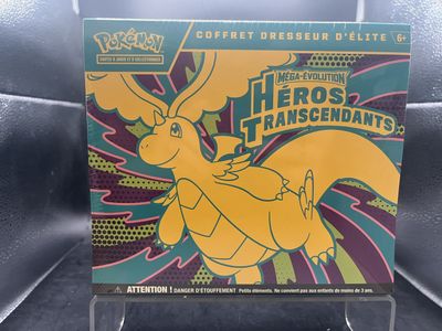 une photo d'une boîte de cartes Pokémon posée sur une table