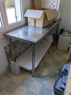 an image of a kitchen area with a table and a window