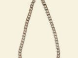 a close up of a necklace with a chain on a white background