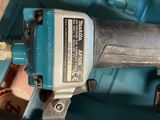 an image of a cord nailer with a blue handle and a blue case