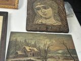 three paintings on a table with a picture of a woman and a man