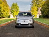 a small car that is parked on the side of the road