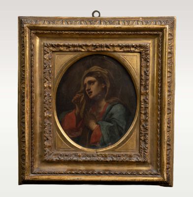 une peinture ancienne représentant une femme tenant un bébé dans ses bras