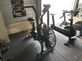 an image of a gym room with a fan and exercise equipment