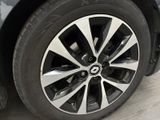 a close up view of a car ' s wheel and tire