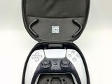 a black and white video game controller in a case
