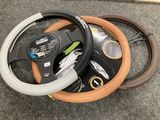 a close up of a steering wheel on a carpeted floor