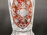 an image of a glass vase with a red and white design