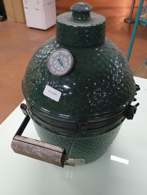a big green egg sitting on top of a table