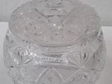 a glass jar with a lid on a white surface