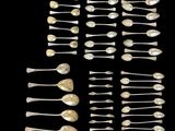 a close up of a bunch of spoons on a black surface