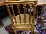 a table with a chair and a rug on the floor