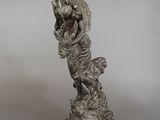 statue of a woman with a goat on her back on a marble base