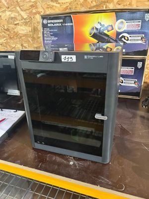 two ovens that are sitting on a shelf in a store