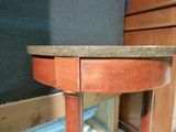 an image of a small table with a granite top